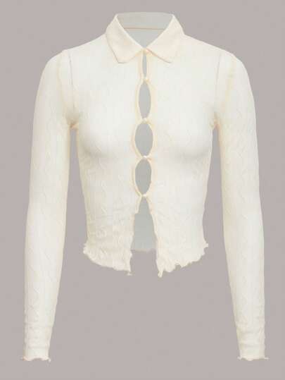 Top corto con bottone tagliato in maglia