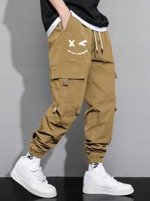 Manfinity Hypemode Pantalones De Carga Sueltos Para Hombres Con Estampado De Expresión, Bolsillos De Solapa Y Cintura Con Cordón