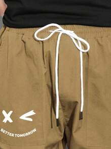 Manfinity Hypemode Pantalones De Carga Sueltos Para Hombres Con Estampado De Expresión, Bolsillos De Solapa Y Cintura Con Cordón
