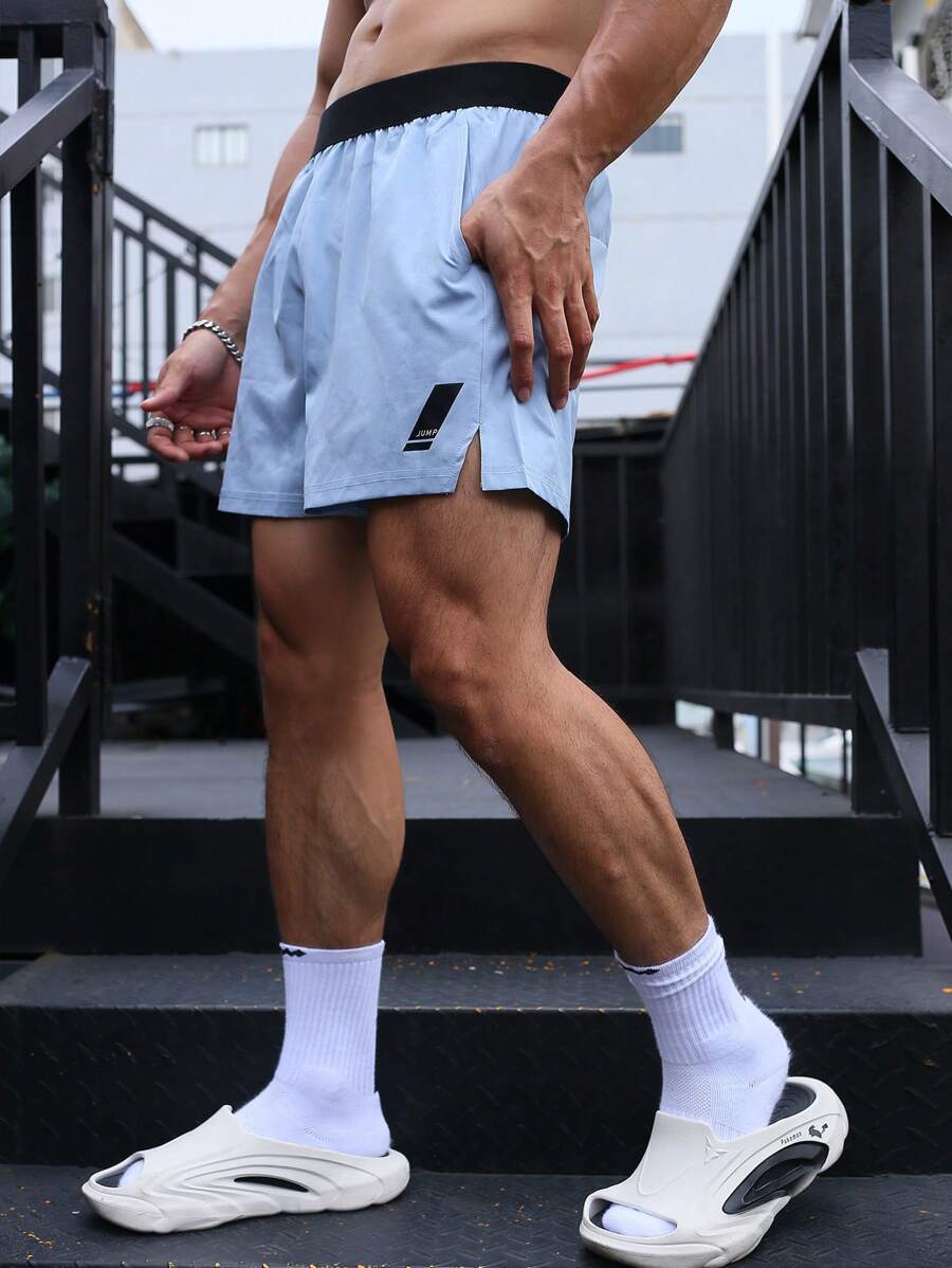 Manfinity Sport Corelite 男友风男士字母图案运动短裤健身短裤慢跑短裤 - 藍色 - 查看 1