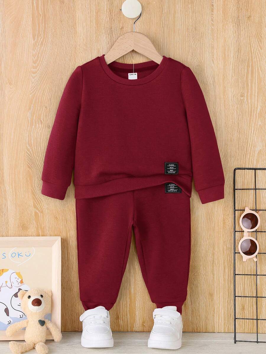 SHEIN Bộ 2 món/Bộ áo nỉ và quần nỉ màu đỏ tía trơn thường ngày cho bé trai, Thu/Đông - Màu Đỏ Sâu - Xem 1