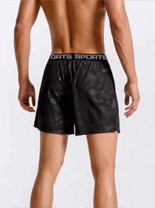 Manfinity Fitness 男士迷彩字母膠帶腰斜口袋運動短褲，健身短褲