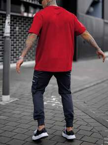Manfinity Homme Camiseta casual de cuello redondo y manga corta con estampado para hombres, para uso diario