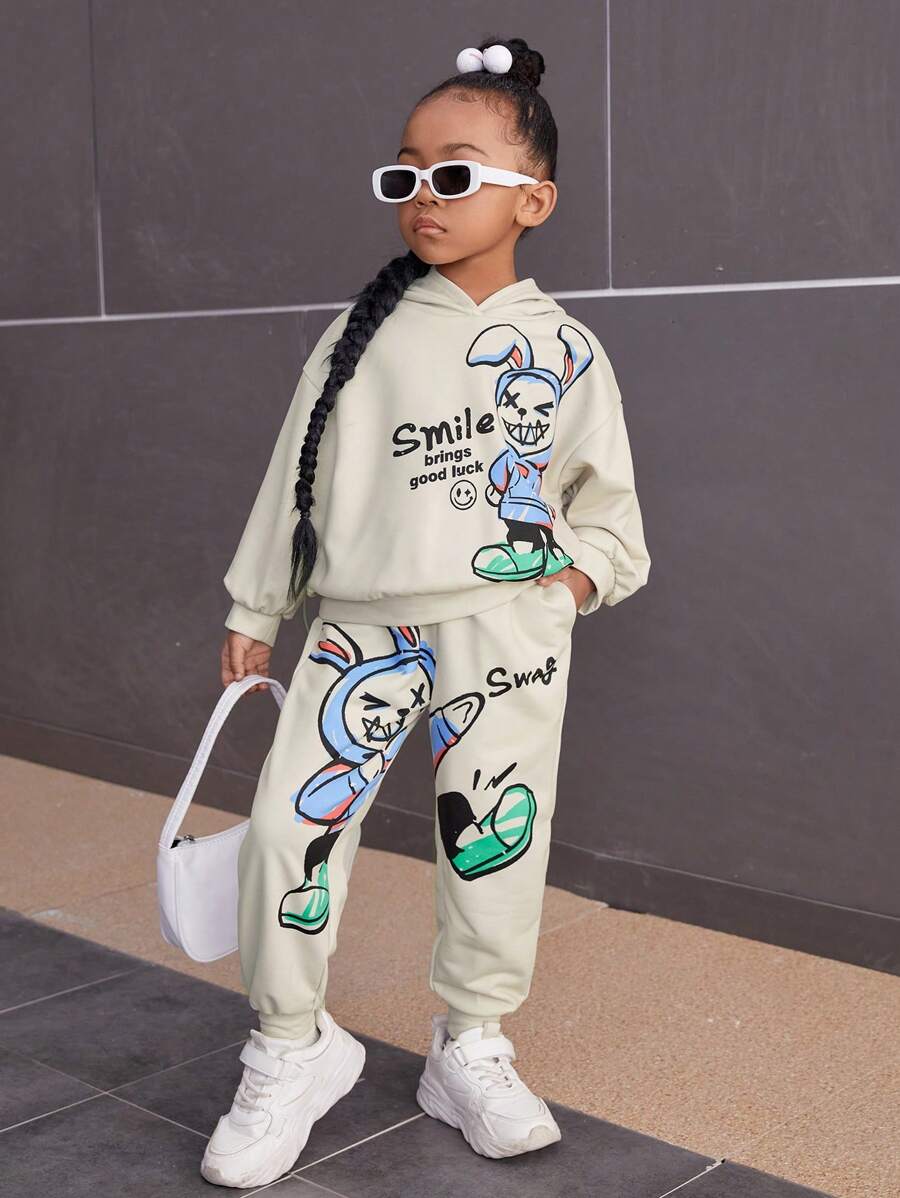 SHEIN Cô Gái Trẻ Đồ họa Hoạt hình Thả vai Áo Hoodie & Quần thể thao - Màu be - Xem 1