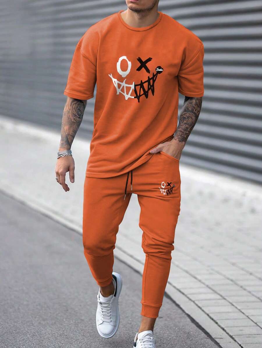 Manfinity Homme Hombres Halloween con estampado de dibujos animados Camiseta & de cintura con cordón Pantalones deportivos - Naranja - Ver 1