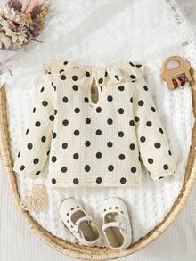 Đứa bé gái In vết tròn Polka Viền Ruffle Lỗ khóa trở lại Áo thun - Đen và trắng - Xem 2