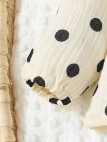 Đứa bé gái In vết tròn Polka Viền Ruffle Lỗ khóa trở lại Áo thun - Đen và trắng - Xem 5