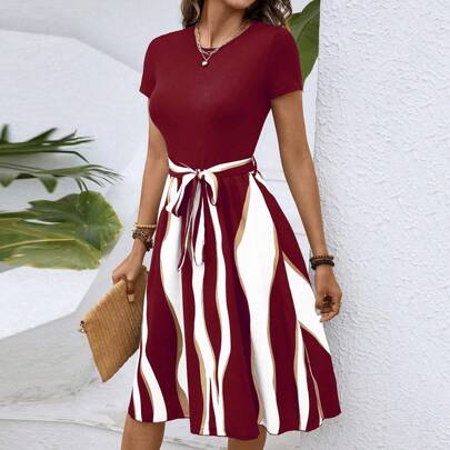 Abito trapezio color block con cintura