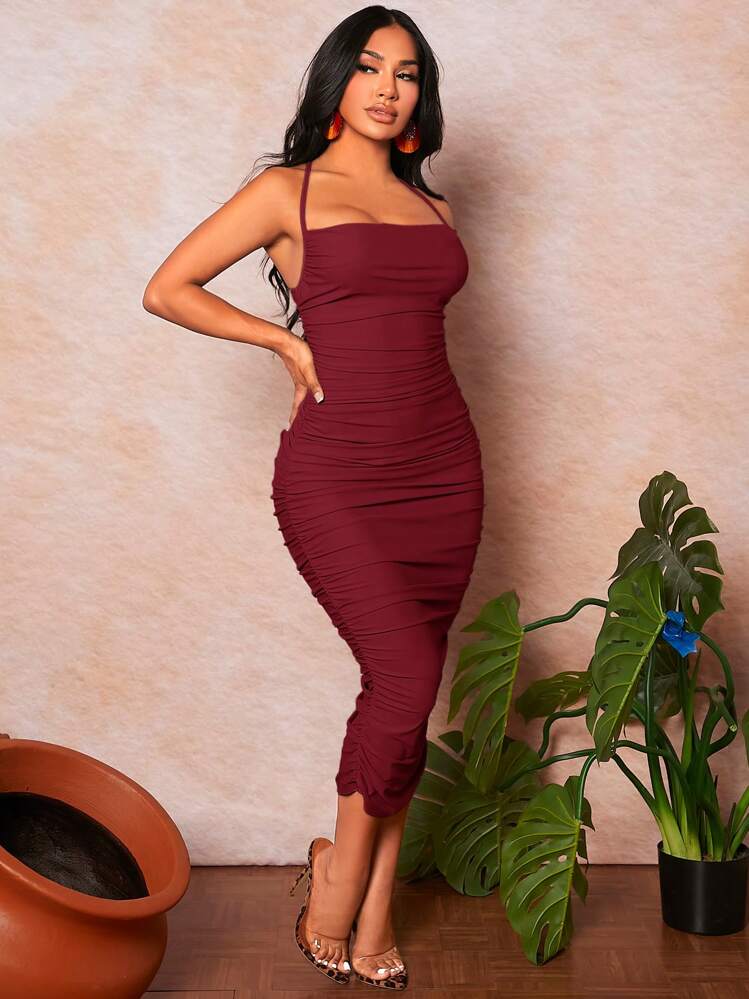 shape burgundy ruched side strappy bodycon dress Bandage dresses are back and better than ever this summer! I'm so glad  they're making a comeback, and this midi dress in rich burgundy is an  absolute showstopper. It's never leaving my closet again!