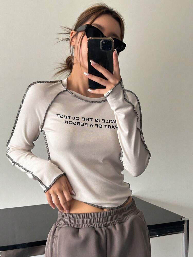 Slogan Graphic Top-Stitching Raglan Sleeve Crop Tee PART OF A PERSON SMILE IS THE CUTEST Long Sleeve Women Tops