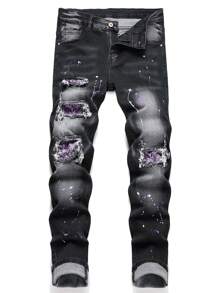 Manfinity LEGND Pantalón Vaquero Slim Fit desgarrado para hombre con estampado de salpicaduras de pintura, jean largo y deshilachado con bolsillos cargo en color negro liso, ideal para fiestas, rock punk y rapero. - Negro - Ver 1
