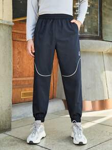 In My Nature 男士字母圖案拼接滾邊斜口袋戶外長褲