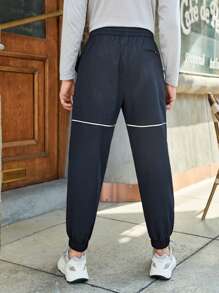 In My Nature 男士字母圖案拼接滾邊斜口袋戶外長褲