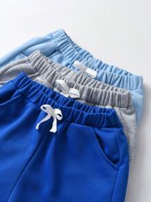 SHEIN Tween Boy 3pcs Solid Bow Front Track Shorts