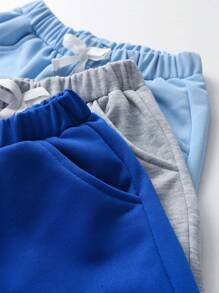 SHEIN Tween Boy 3pcs Solid Bow Front Track Shorts