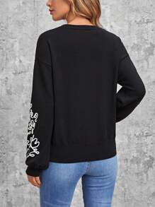 Jersey con patrón floral de hombros caídos - Negro - Ver 2