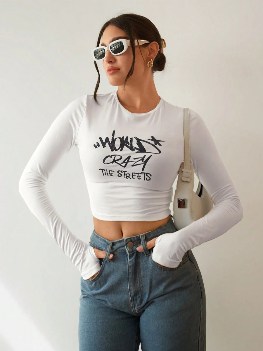 SHEIN Essnce Slogan Graphic Crop Tee WORLD'S CRAZY THE STREETS - White - View 1