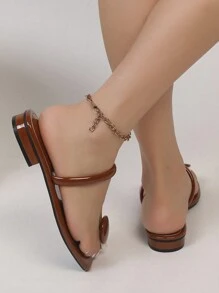 女式低跟圆扣凉鞋，简约系带设计