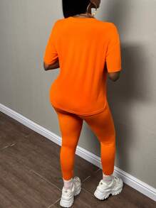 Slaydiva 熒光橙數字圖案落肩T恤&緊身打底褲