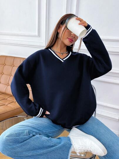 Sudadera con hombros caídos y ribete de rayas