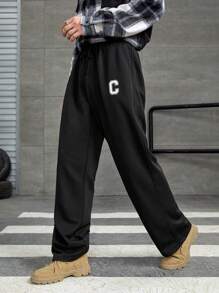 Manfinity Hypemode Hombres Pantalones deportivos con estampado de letra y cordón en la cintura - Negro - Ver 1