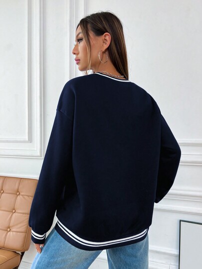 Sudadera con hombros caídos y ribete de rayas