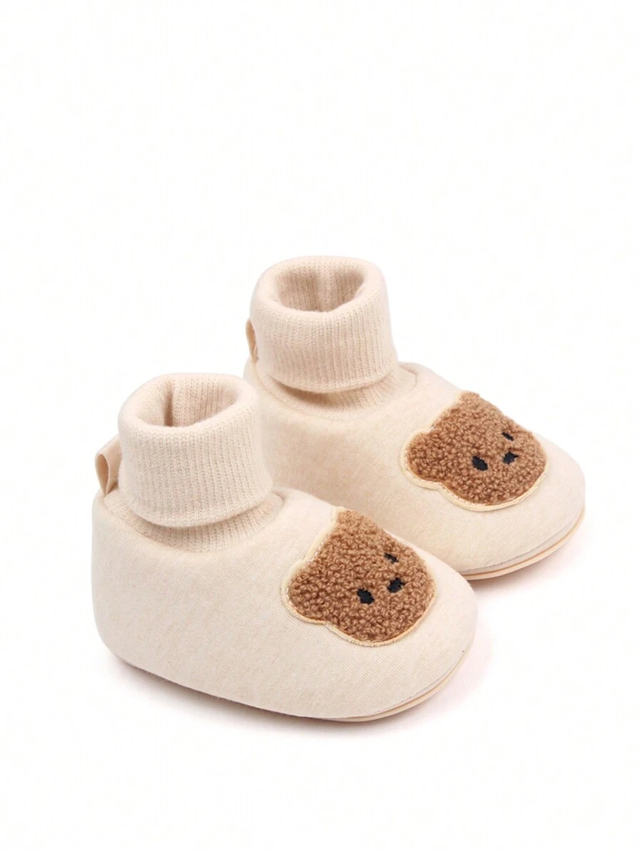 Un par de botas con diseño simple de oso de moda y para bebé neutral - Albaricoque - Ver 1