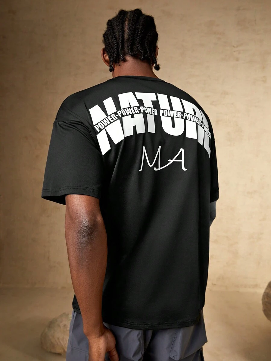 Manfinity Sport Corelite Camiseta deportiva con gráfico de letras, estilo novio para hombre - Negro - Ver 1