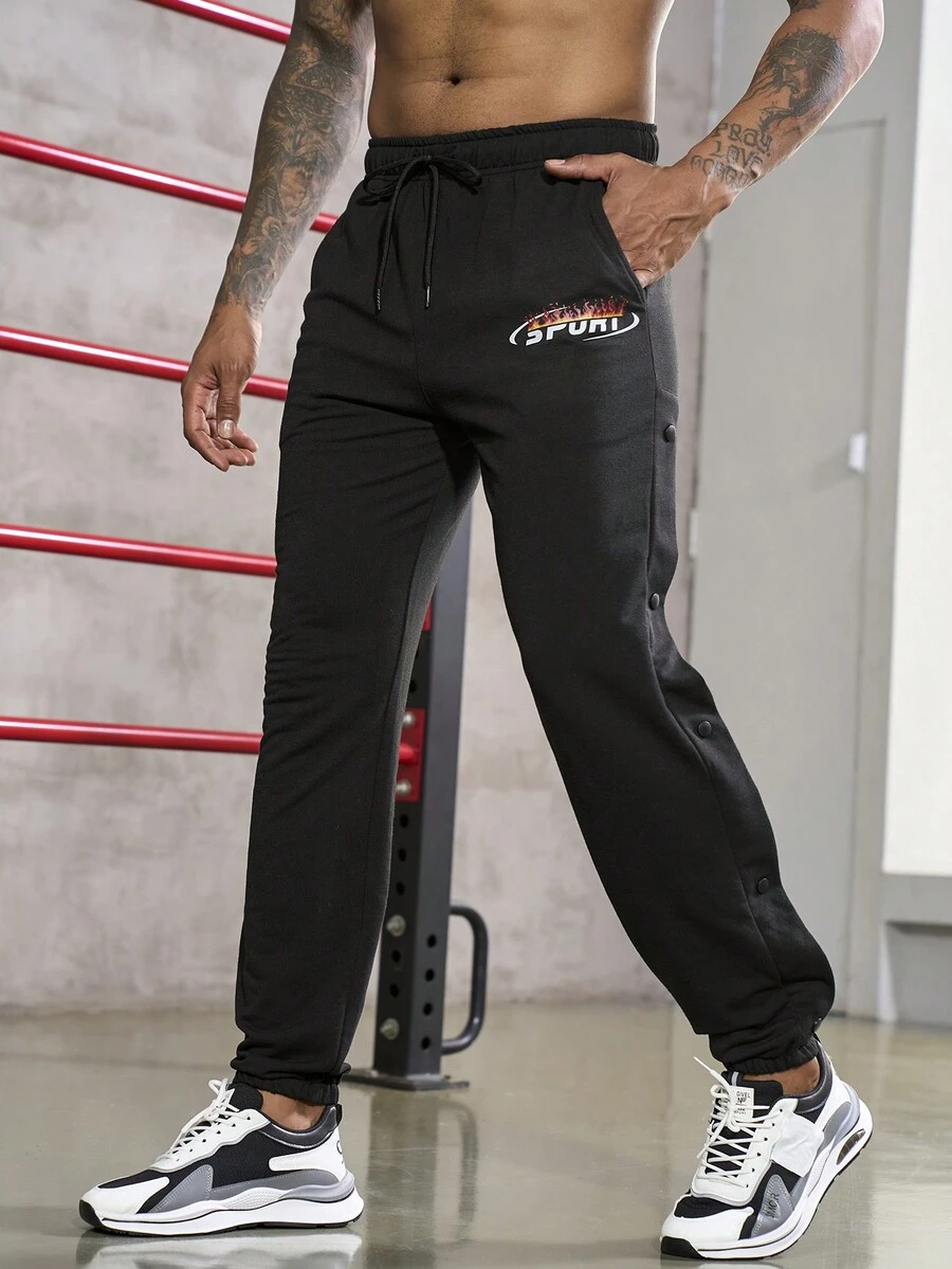 Gym Rark Men's Drawstring Sports Pants Featuring Letter Print Sweat Pants - Black - View 1