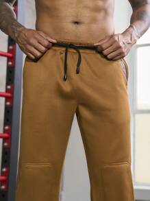 Manfinity Sport Corelite Uomo Pantaloni sportivi con grafica lettera con coulisse a vita tasca inclinata