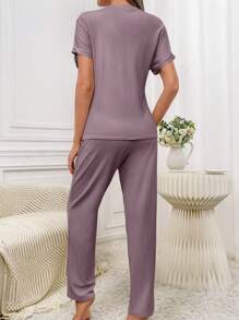 Conjunto de pijama de camiseta y pantalones de punto acanalado