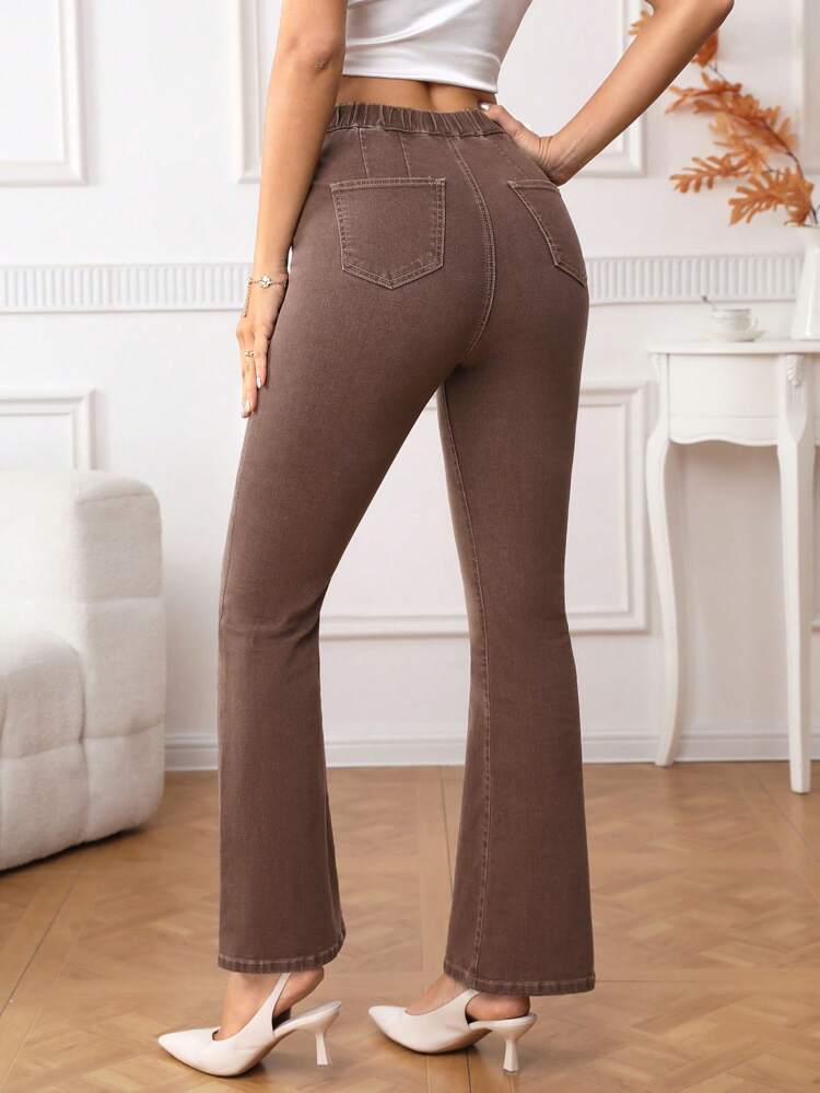Asymmetrical Waist Flare Leg Jeans