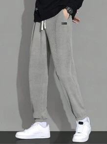 休閒抽繩 口袋 貼布字母 純色男士褲子