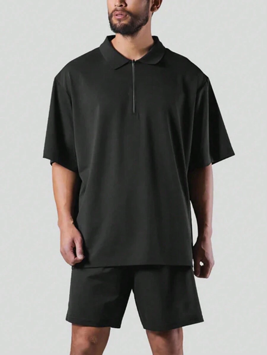 Manfinity Sport Corelite Herren Sport Polo Shirt mit halbem Reißverschluss, einfarbig, Workout Tops, Golf Shirt - Schwarz - Übersicht 1