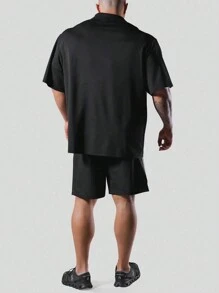 Manfinity Sport Corelite Herren Sport Polo Shirt mit halbem Reißverschluss, einfarbig, Workout Tops, Golf Shirt - Schwarz - Übersicht 2