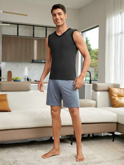 Men's Dark Grey V Neck Regular Length Sleeveless Basic Thermal Underwear Vest In Knitted Fabric With Contrast Binding And Medium Stretch For Comfort.