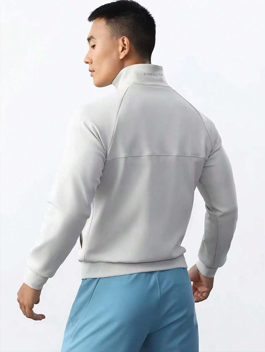 Manfinity Sport Corelite Áo khoác thể thao nam kiểu dáng bạn trai, tay áo raglan, cổ đứng, có khóa kéo, họa tiết chữ, áo tập luyện - trắng - Xem 1