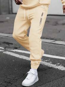 Manfinity Homme Nam Lỏng lẻo phù hợp Quần thể thao Với In Khẩu hiệu Và Eo dây rút - Màu Khaki - Xem 1