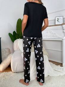 Conjunto de pijama con camiseta estampado de dibujos animados y pantalones
