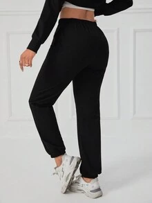 SHEIN Unity Pantalones deportivos unicolor de cintura elástica - Negro - Ver 2