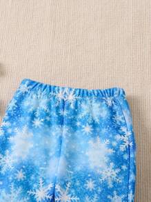 SHEIN Young Girl Figure Graphic Snowflake Print Flare Leg Pants