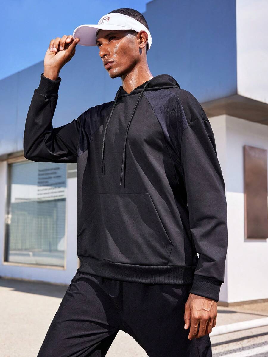 Manfinity Sport Corelite Sudadera deportiva con capucha con cordón y mangas raglán en estilo boyfriend con bloques de color para hombres, sudadera estilo boyfriend negra - Negro - Ver 1