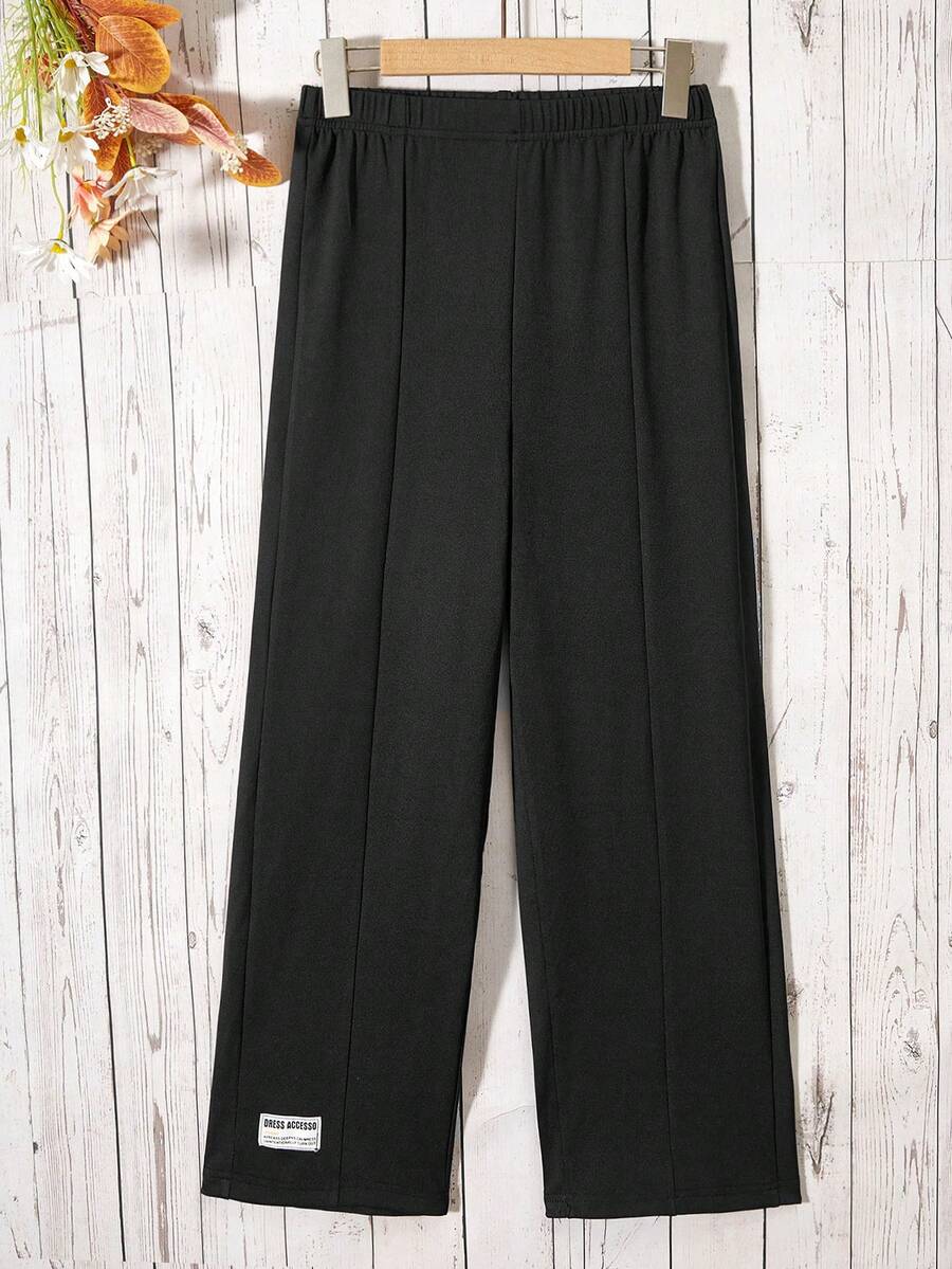 SHEIN Quần ống rộng cho bé gái tuổi teen, có bo chun ở gấu quần và trang trí đường viền bằng vải dệt. - màu đen - Xem 1