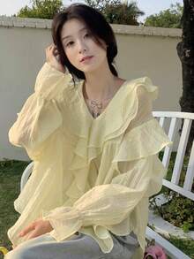 泡泡長袖襯衫,帶有襯褶v領