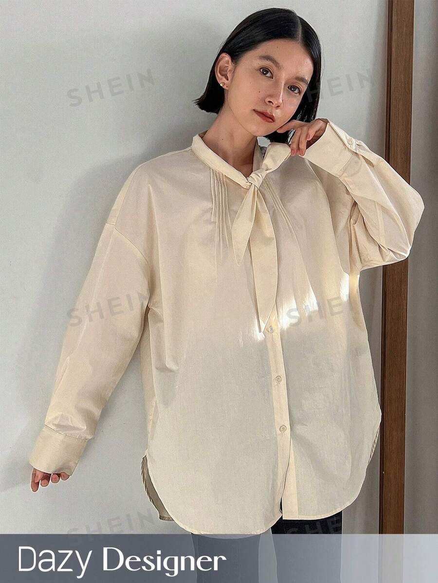 Dazy Designer Blusa de manga larga con botones y nudo en el frente, de unicolor y hombros caídos para mujer