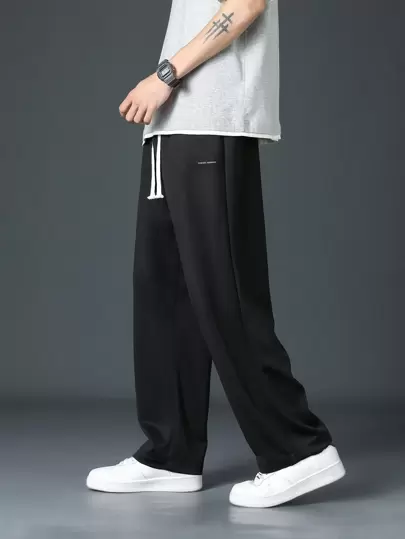 Pantalones casuales minimalistas negros con cordón en la cintura para hombre