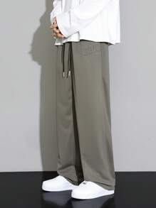 Men's Casual Solid Color Letter Embossed Drawstring Waist Long Pants