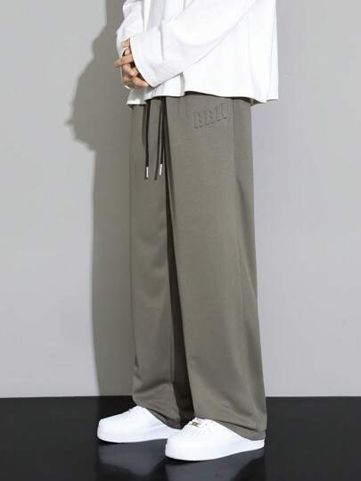 Men's Casual Solid Color Letter Embossed Drawstring Waist Long Pants