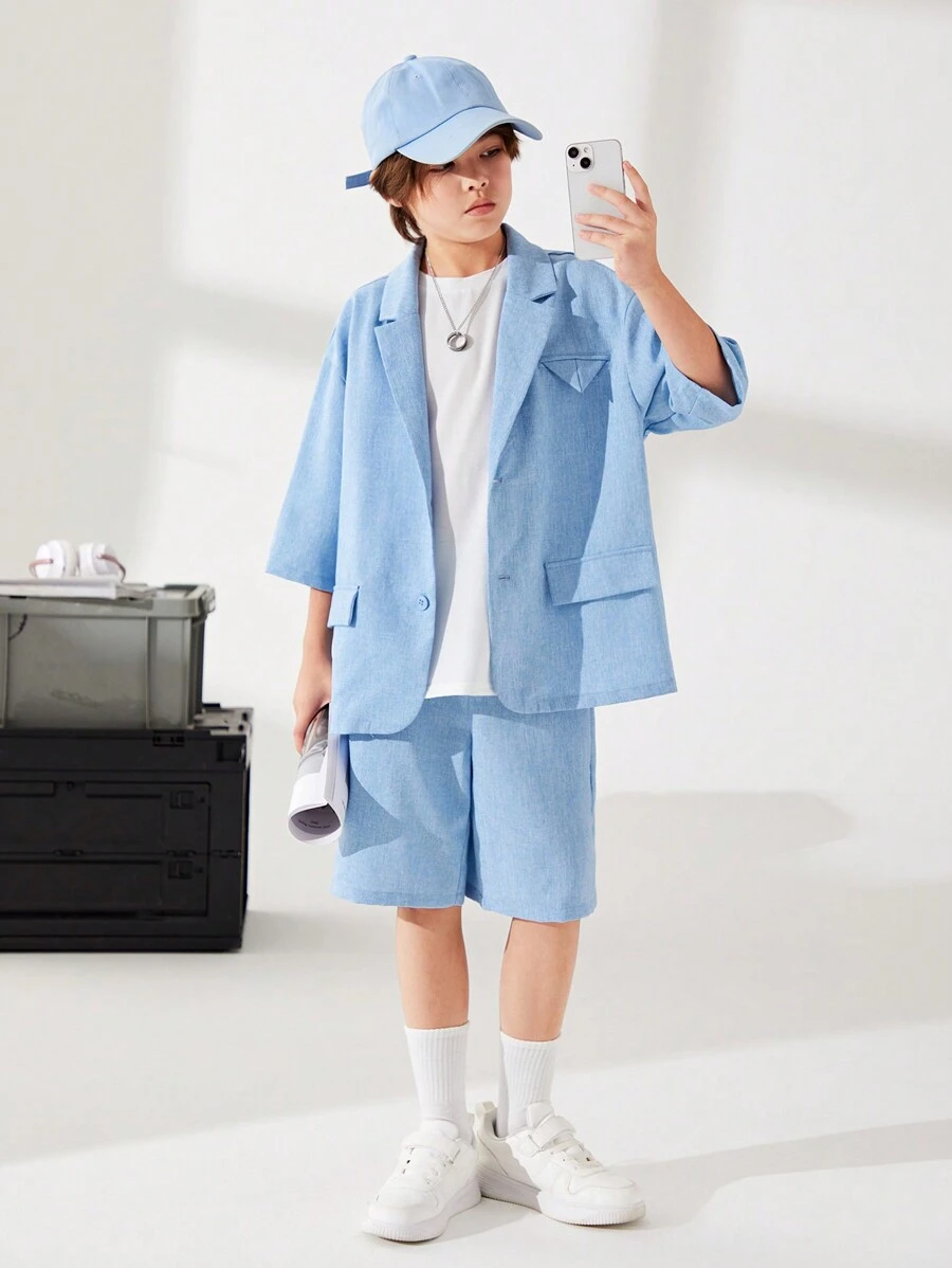 SHEIN Cậu bé Tween Giải trí Hàn Quốc Phong cách Lỏng lẻo phù hợp Ngắn tay Áo vest Áo khoác Với Vòng cổ Và màu trơn Dệt Quần short Hai chiếc Bộ - Màu xanh lam - Xem 1