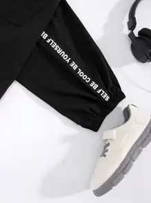 SHEIN Calças Folgadas De Tecido Casual Resort Para Meninos Adolescentes Com Patch De Letras E Bolsos De Patch Tridimensionais.